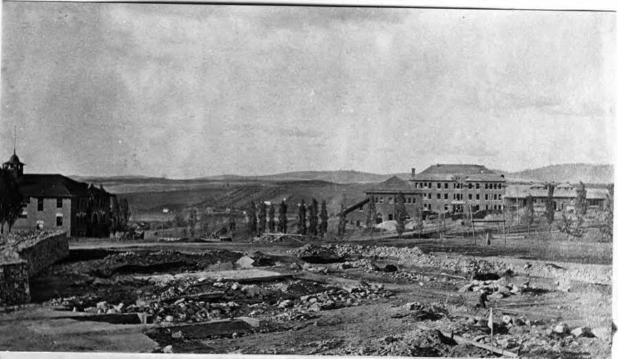 After the wreckage was nearly cleaned up. First gymnasium at left and Morrill Hall, still incomplete far right in picture.