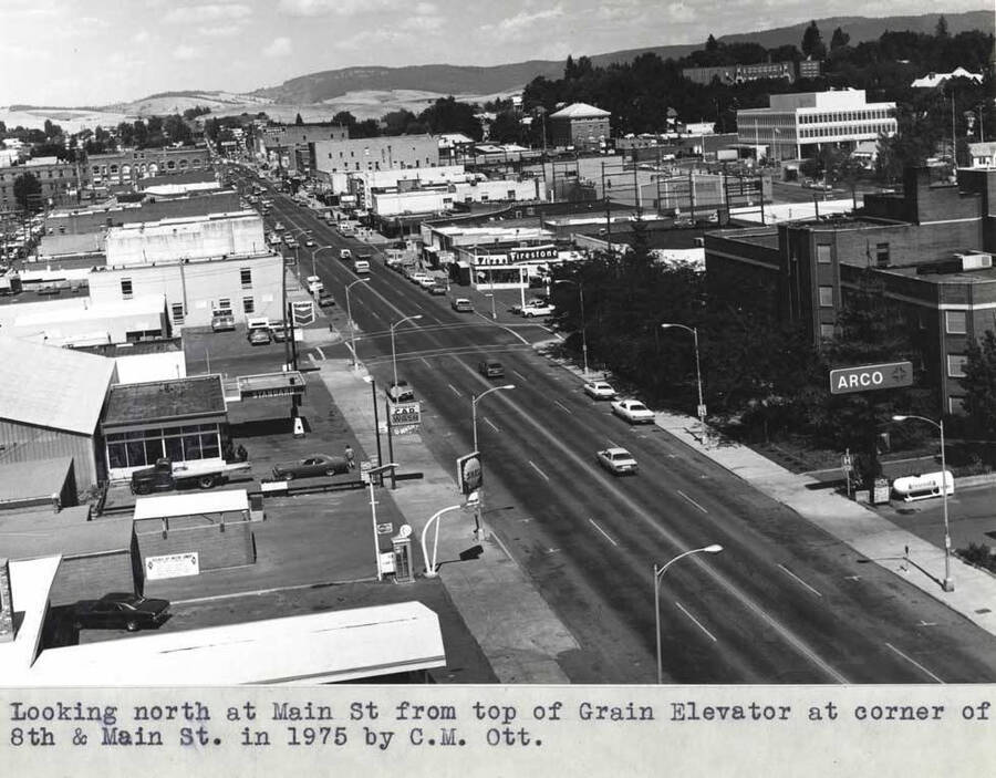 Looking north at Main Street from top of grain elevator at corner of Eighth and Main streets in 1975 by C.M.  Ott. Moscow.