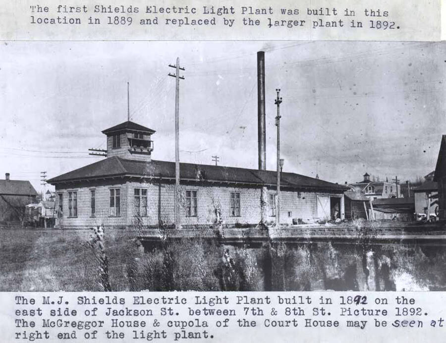 Built in 1892 on the east side of Jackson Street between Seventh and Eighth streets. Picture 1892. McGregor House and cupola of the Courthouse may be seen at right end of the light plant. The first Shields electric light plant was built in this location in 1889 and replaced by the larger plant in 1892.