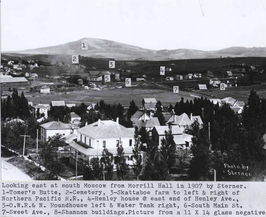 1- Tomers Butte, 2- Cemetery, 3- Skattaboe farm to left and right of Northern Pacific Railroad, 4- Henley house at east end of Henley Avenue, 5- O.R. & N.  [Oregon Railroad and Navigation] roundhouse left  and water tank right, 6- South Main Street, 7- Sweet Avenue, 8- Shannon buildings. Picture from a 11 x 14 glass negative.