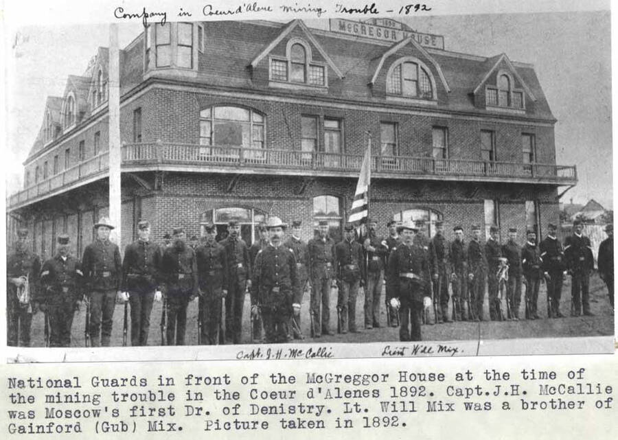 National Guards in front of the McGregor House at the time of the mining trouble in the Coeur d'Alenes 1892. Capt. J.H. McCallie was Moscow's first doctor of dentistry. Lt. Will Mix was a brother of Gainford (Gib) Mix. Picture taken in 1892.