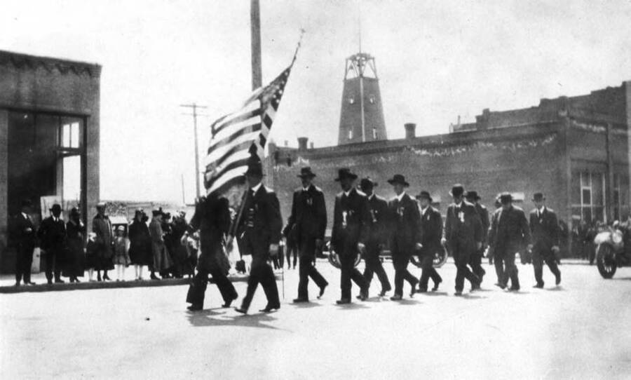 G.A.R. veterans of the Civil War marching east on Third Street at Washington Street about 1912. Moscow Fire Department bell tower in background.