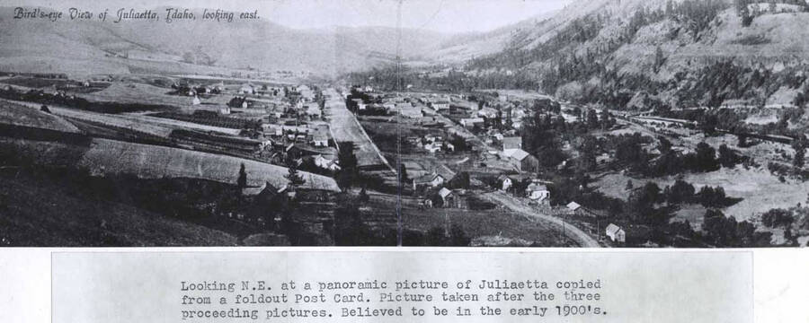 Copied from a foldout postcard. Picture taken after the three preceeding pictures [90-4-067, 068, 069]. Believed to be in the early 1900s. Wording on photo: 'Bird's-eye View of Juliaetta, Idaho, looking east.'