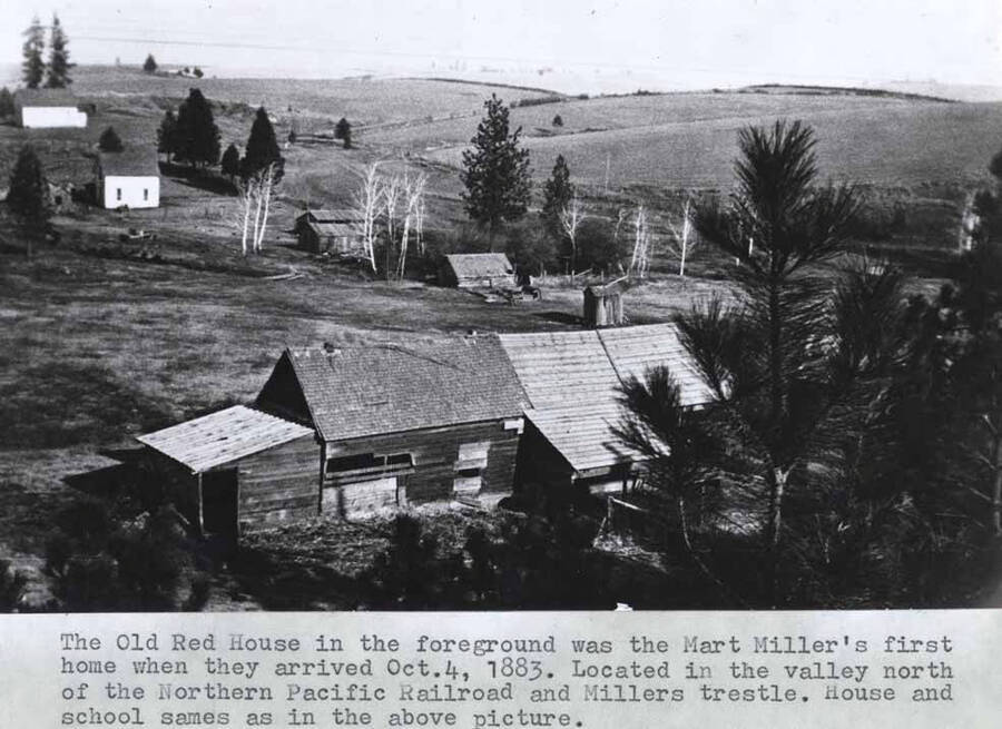 In the foreground was the Mart Miller's first home when they arrived October 4, 1883. Located in the valley north of the Northern Pacific Railroad and Miller's trestle. House and school same as in the above [90-4-142] picture.