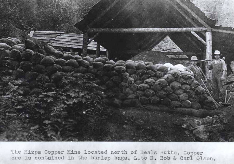 Located north of Beals Butte. Copper ore is contained in the burlap bags. Left to right: Bob and Carol Olson.
