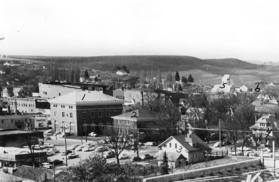 Looking northwest from the new Courthouse under construction. 1- Federal Building (post office), 2- Christian Church, 3- Dr. Asbury residence, 4- Methodist parsonage, 5- O'Donnell warehouse, 6- Idaho National Harvest building. Picture 1958.