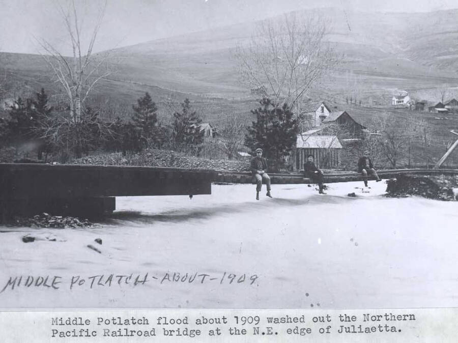 About 1909. Washed out the Northern Pacific Railroad bridge at the northeast edge of Juliaetta. Wording on photo: 'Middle Potlatch - About - 1909'.