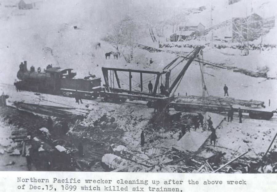 Northern Pacific [Railroad] wrecker cleaning up after the above wreck [90-4-094] of December 15, 1899, which killed six trainmen.