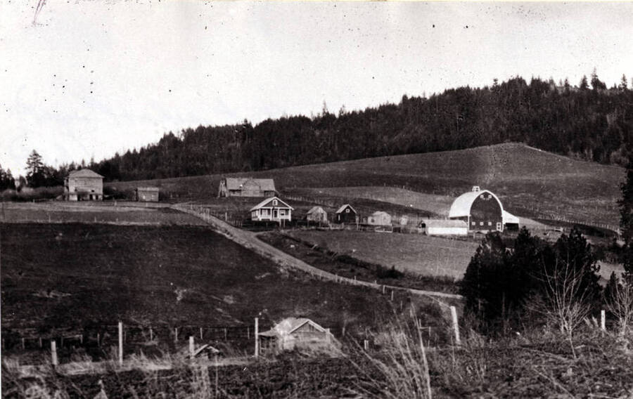 Looking east at the Seventh Day Adventist dormitory, left, and their school to the right. Located behind the Schoepfler homestead about three miles southeast of Viola, in 1930.