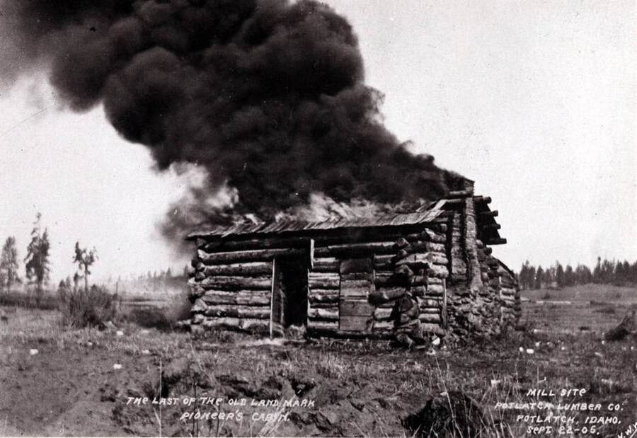 The last of the old landmarks, pioneer's cabin, being burned to make way for the construction of the Potlatch Lumber Company mill. September 22, 1905.