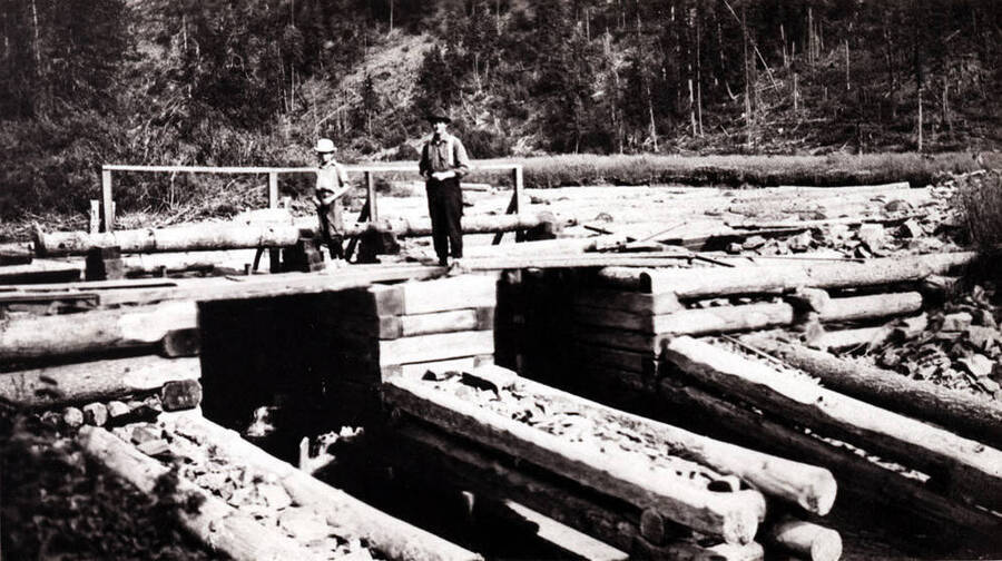 In the Palouse River at the south side of Potlatch. This was to hold the logs back in the pond until needed at the mill in Potlatch. Early 1900s.