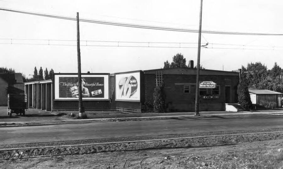 Office and freight depot rebuilt from the old "Nat" building above [90-2-146]. Picture 1940s. The electric trolley in the two above pictures [90-2-146, 90-2-147] was the Spokane & Inland Electric Railroad line to the Mark P. Miller Flour Mill at the southwest corner of Sixth and Jackson streets.