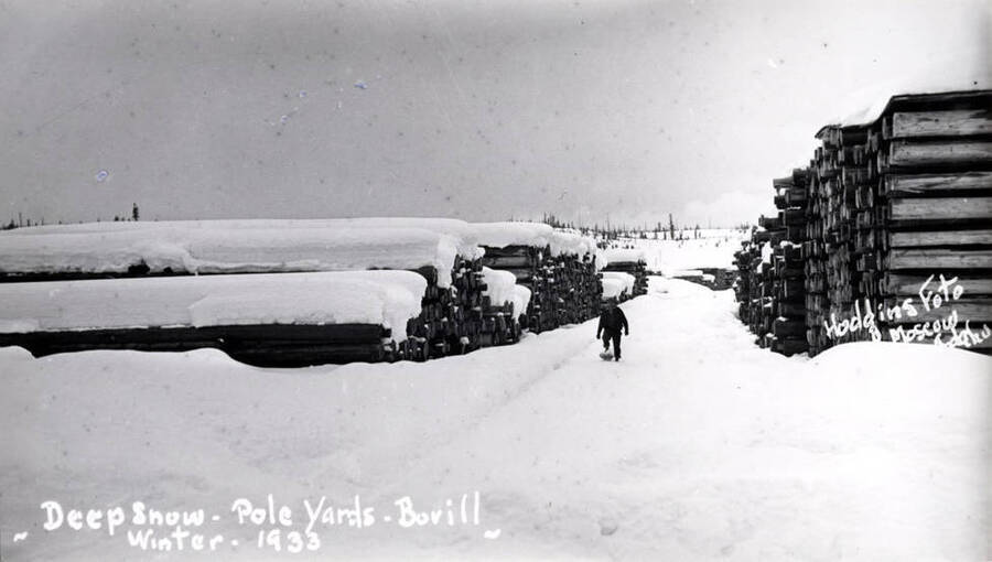 Wording on photo: Deep snow - pole yards - Bovill. Winter 1933. Hodgins Photo Moscow, Idaho.