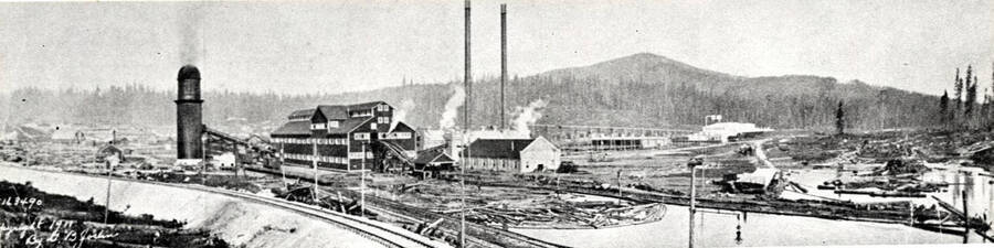 [photo of newspaper photo and caption?)] Elk River sawmill as it looked in 1911. Axel helped cut the trees to clear the land for the townsite in 1909. In 1910 he helped dredge out the area for the log pond shown in foreground.