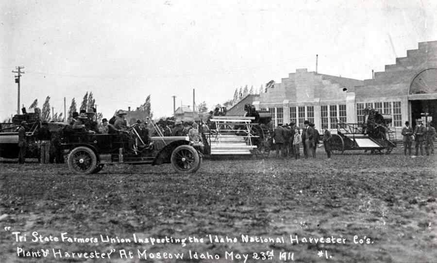Wording on photo: "Tri State Farmers Union inspecting the Idaho National Harvester Co.'s plant & harvester at Moscow Idaho May 23rd, 1911. #1.'