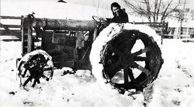 Fordson tractor on the Andrew Mortensen farm, Blaine in 1921. Alma Willis, driving tractor, became the wife of Harry Mortensen in 1920.