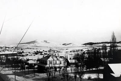 Looking southeast from Morrill Hall. Birds-eye view of Tomer's Butte (Granite Hill) surrounded by Lava Dunes and Moscow, Palouse Country. Picture from a glass transparency at the McConnell Mansion.