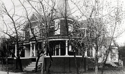 M.H. Rhodes residence built in the 1890s, remodeled early 1900s. Located at the northeast corner of Eighth and Washington streets. Rhodes was the inventor and builder of the first Rhodes Harvester in a foundry and machine shop at 810 South Main Street, about 1911-1913.