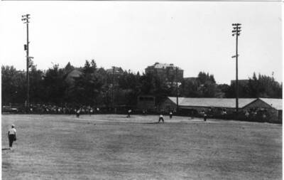 Playgrounds at the Latah County Fair Grounds, north of Sixth Street and west of the railroads. Looking southwest. Fair buildings at right in picture, from Idahonian. 1940s.