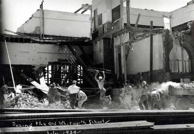 Caption reads: "Razing Whitworth School July 1939. Picture by Charles Dimond of Hodgins Drug Store."
