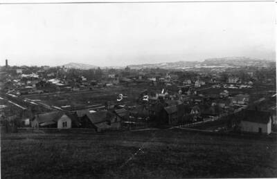 Nos. 1 and 2 houses are to be seen in their new location on Almon Street. No. 3 shows the block north of A Street between Jackson and Almon streets cleared for the arrival of the Spokane & Inland Electric Railroad.