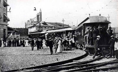 Spokane & Inland Electric train? Looking south, 1- Spokane & Inland Electric Railroad depot, Spokane; 2- [Spokesman] Review tower [Spokane, Washington], 3- Spokane Athletic Club. Monroe Street bridge right.