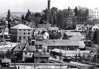 Only drive-in feed sheds in Moscow. Teams could be left hooked to the buggies or wagons and tied to the mangers where they could be fed hay and grain. On the east side of Washington Street between Fourth and Fifth streets and east to alley. In lower right-hand corner of picture. Built early 1900s.