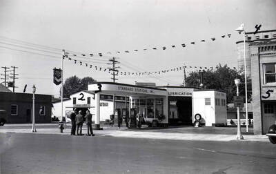 Looking southwest at the corner of Seventh and Main streets. No. 1- Standard Lumber Company office (later razed) southwest corner Seventh and Main streets, 2- Standard Lumber Company southeast corner Seventh and Jackson streets, 3- Standard service station northwest corner Seventh and Main streets, 4- top of Latah County Grain Growers concrete elevator west side of Jackson Street, Moscow Steam Laundry 623 South Main.