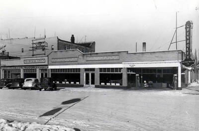 Northwest corner of Second and Washington streets. Left, Lawton Motors. Right, Inland Motor Company, Chevrolet dealer. January 1937.