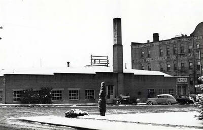 Southwest corner of First and Washington streets. This is the north side of the top picture [90-9-127]. January 1937. See Williamson's Store advertising on east end of the McConnell Building.