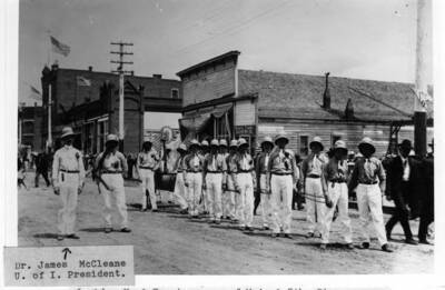 Harness shop northeast corner of Main and Fifth streets. Pacific Coast & Elevator, southeast corner Main and Fifth streets. Moscow Hose Cart Co. in foreground. Early 1900s.