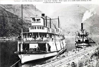 Spokane and the Corps of Engineers' snag boat "Asotin" share space at north bank landing in the neighborhood of Almota.