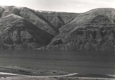 Area once covered with fruit trees shows the water rising due to the gates being closed at Lower Granite Dam. February 15, 1975.