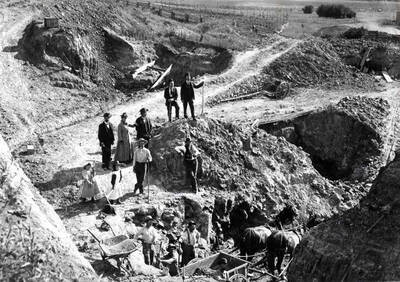 Seven miles northwest of Moscow is Missouri Flat, 7/10's of a mile beyond the Idaho-Washington state line in Washington on the north side of the road behind the John O'Donnell buildings. Picture taken in 1892. See Ron Brockett's publication [Moscow Opal Mines 1890 to 1893] for names of people in picture.