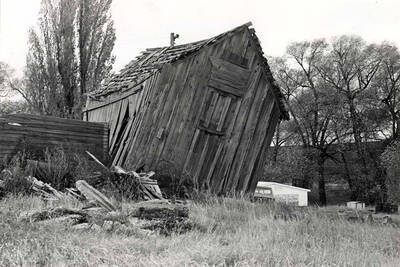 Looking west past the Clinton post office at the location of the pioneer buildings now occupied by a mobile home. 1977.
