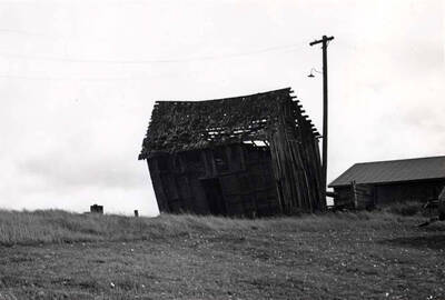 Looking southeast at the Clinton post office showing modern machine shed at right. Pictures by Clifford M. Ott October 30, 1977.