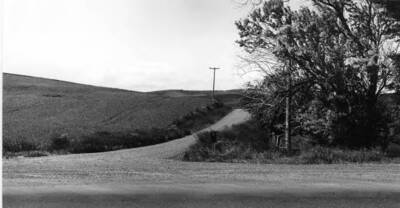 No. 1 - On map. Top [90-0112] picture five miles south of Moscow on Highway 95 and junction of the Jacksha Road. No. 1- Dr. C.J. Brosnan, No. 2- George W. Tomer (guide). Top picture [90-0112] taken 1937. Bottom picture [90-0113] shows no marker June 25, 1976.