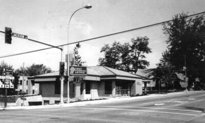 At the new home of the First Federal Savings Bank built during the winter of 1988 and 1989. Occupied June 12 with an open house June 24, 1989. The First Federal Savings sign was from another picture as the original sign did not show from this angle. Picture June 25, 1989. By Clifford M. Ott