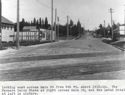 The Farmers Union store at right across Main Street and the Latah Hotel at left in picture.