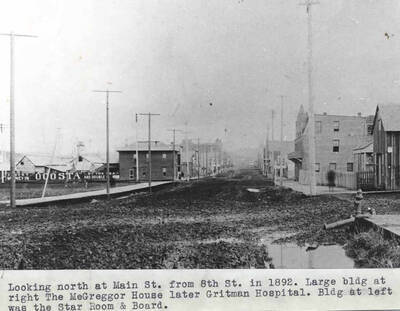 Large building at right the McGregor House later Gritman Hospital. Building at left was the Star Room and Board.