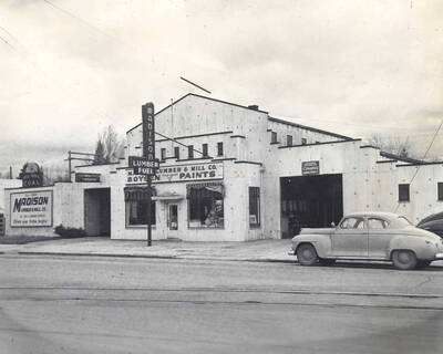 Madison Lumber Company was located at 824 South Main Street and established in 1903 by Gunder P. Kjosness who came to Moscow with his wife and eight children from Madison, Wisconsin. The Madison Lumber and Mill Company is the oldest lumber company in the Inland Empire. It suffered two fires, one in 1934 and the other in 1968 when the above building burned to the ground [90-3-069]. It has been replaced by a new building at the same location and occupied by the Troy Lumber Company. 1976.