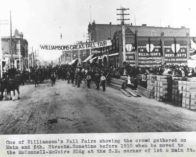 Showing the crowd gathered on Main and Fifth streets. Sometime before 1910 when he [Williamson] moved to the McConnell-Maguire building at the southeast corner of First and Main streets.