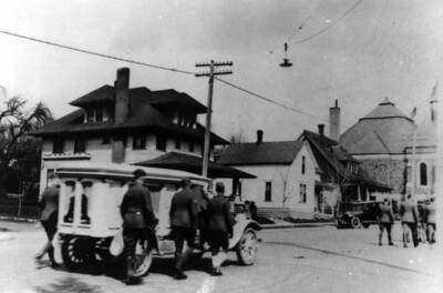 Going east to the Methodist Church for the Archie Hawley funeral services. Hawley was killed in action of World War 1, and first reported as missing in action. Sergeant Clifford M. Ott center pall bearer at right of hearse.