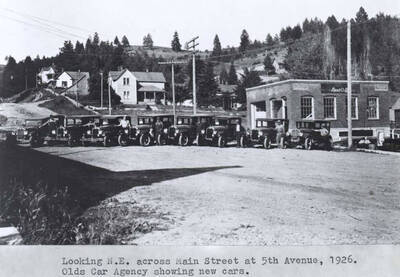 At Fifth Avenue, 1926. Olds [mobile?] car agency showing new cars.