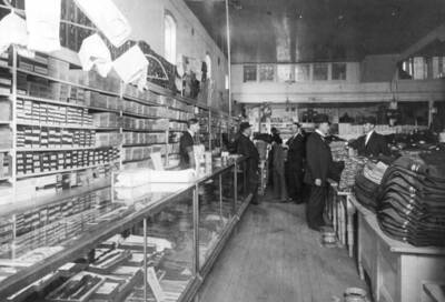 Left to right: Earl David behind counter, B.T. Byrnes, Homer David, F.A. David in derby and Bill Lee, a Moscow attorney.