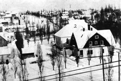 Looking northeast from the old Courthouse in 1910-11. 1- Presbyterian Church parsonage, 2- Presbyterian Church, 3- Swedish Lutheran Church, 4- Van Buren Street, Fourth Street in foreground.
