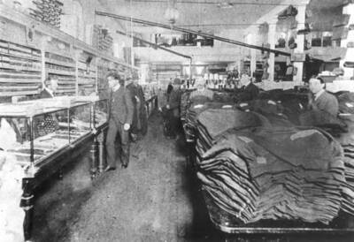 Predates picture number 97 [90-2-097]. Homer Estes in front of counter only one identified.