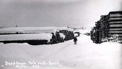 Wording on photo: Deep snow - pole yards - Bovill. Winter 1933. Hodgins Photo Moscow, Idaho.