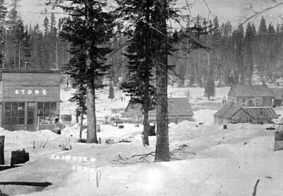Showing the store and post office during a severe winter with lots of snow. Name was later changed to Slabtown as [southern] Idaho already had a Fairview registered with the U.S. Postal Department. It was located about two miles north of Bovill.