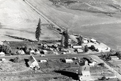 Looking north. 1- Aslin Finch Company elevator, 2- Depot converted into home, 3- Depot converted into a store. One depot was at Princeton, the other from Harvard. Picture by Clifford M. Ott September 1971.